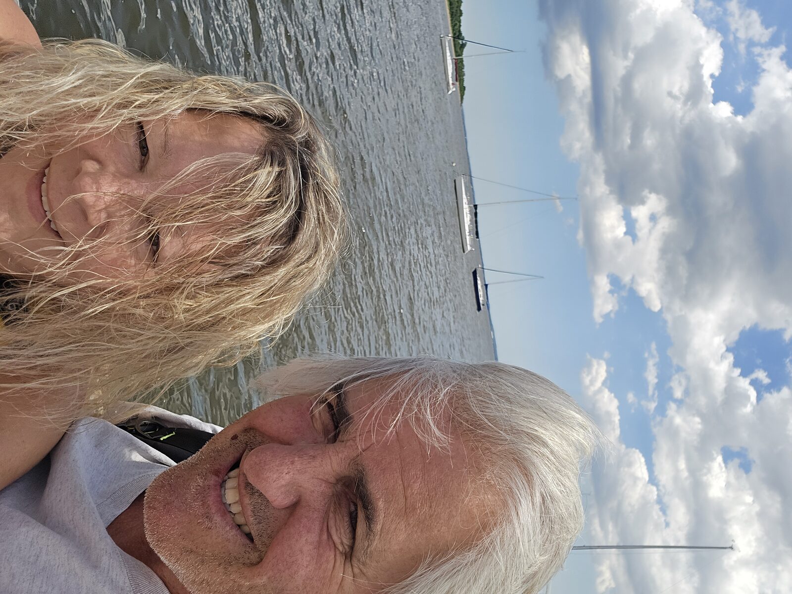 Bourbon and Tequila together on the water, smiling